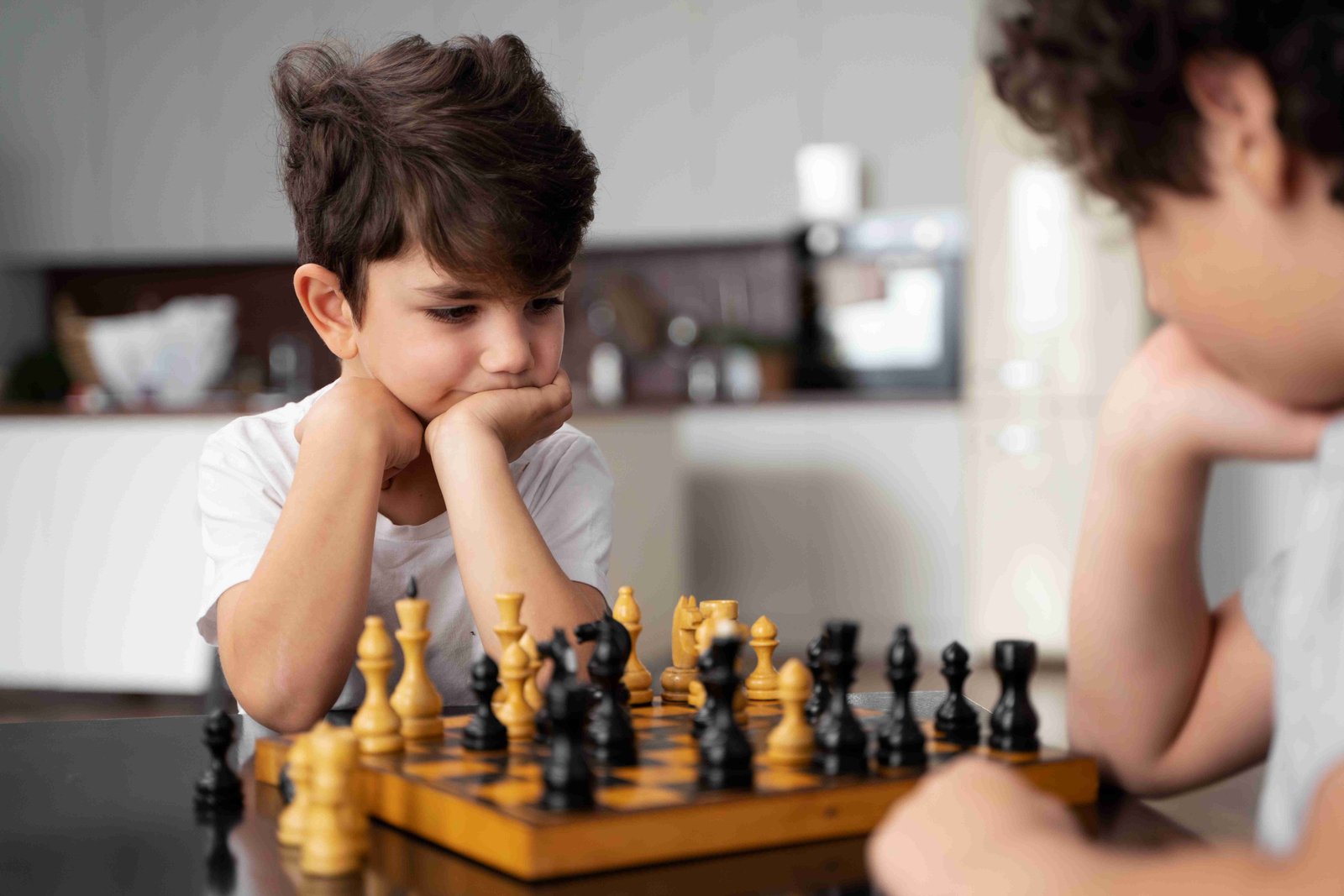 Kids playing chess
